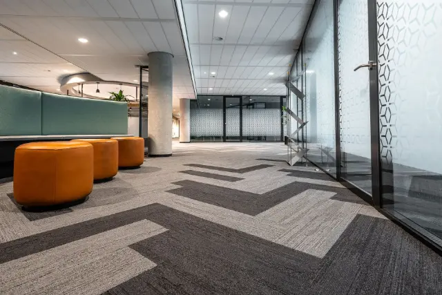 Clean patterned carpet in office workspace 
